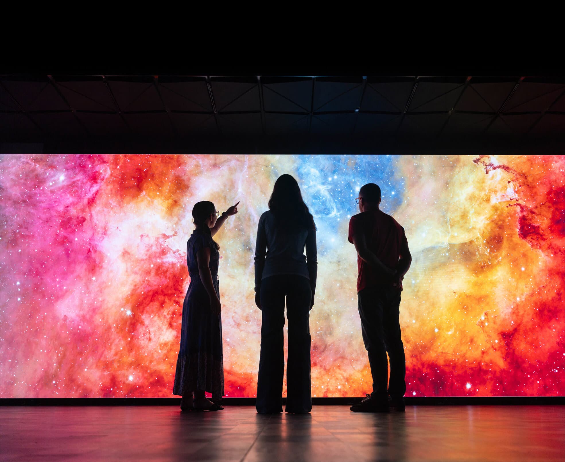 Visitors standing before the SVU LED wall